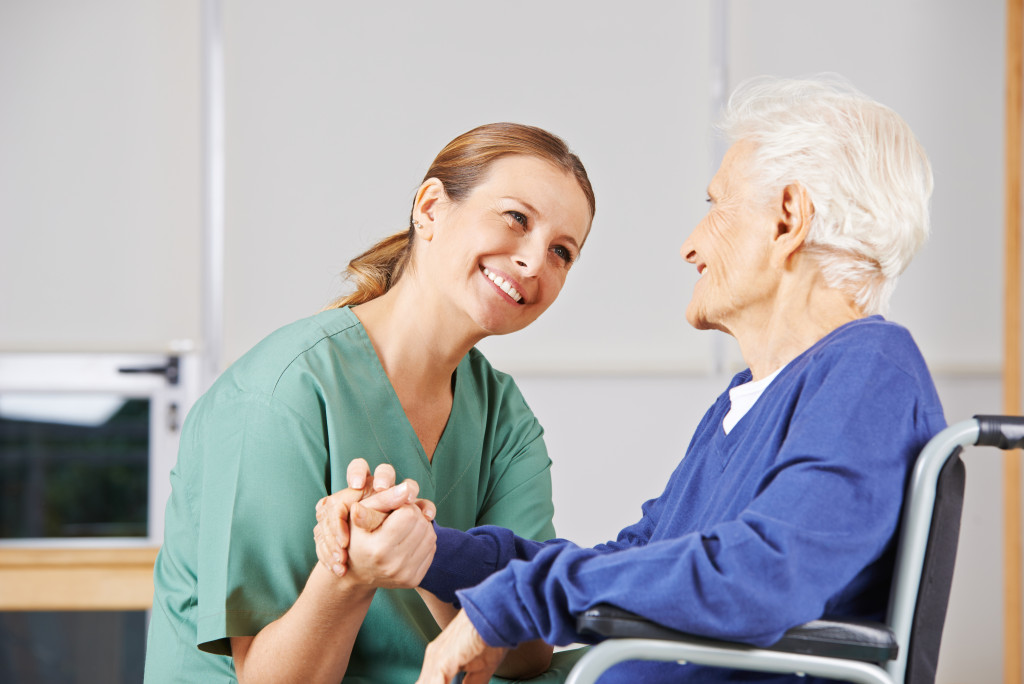 caregiver with senior stroke patient
