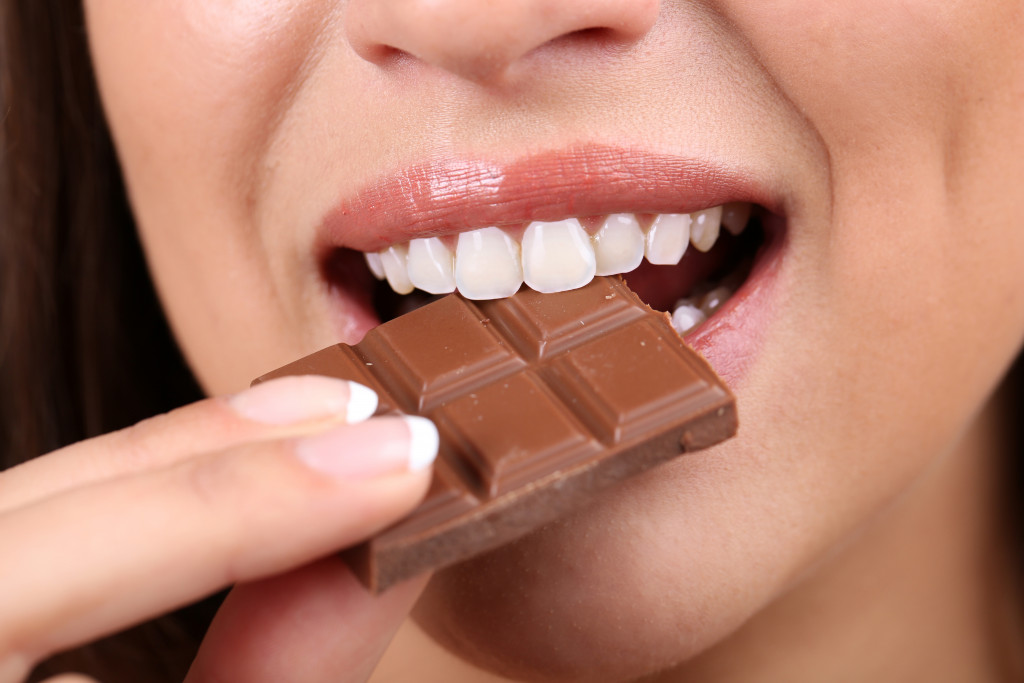 a person eating chocolate