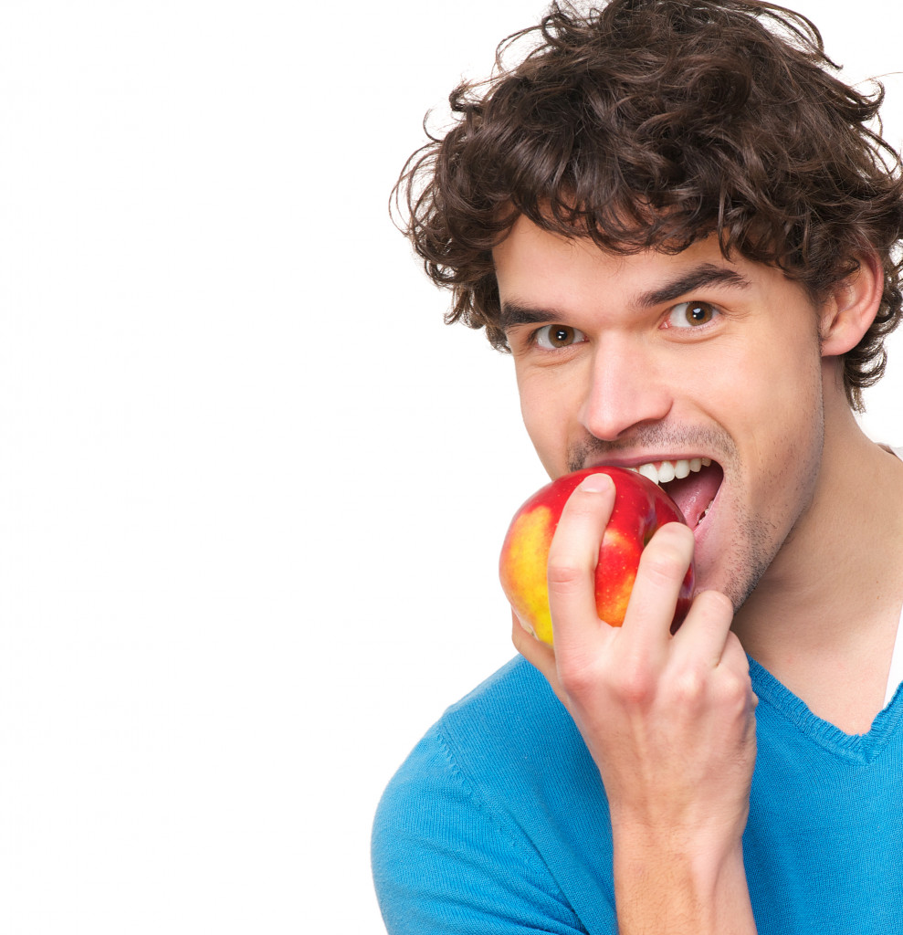 man biting an apple