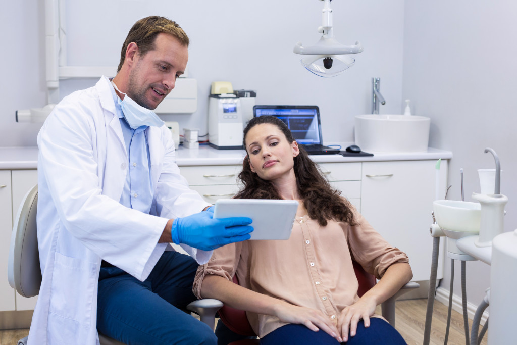 A dentist discussing the results of consultation to a patient