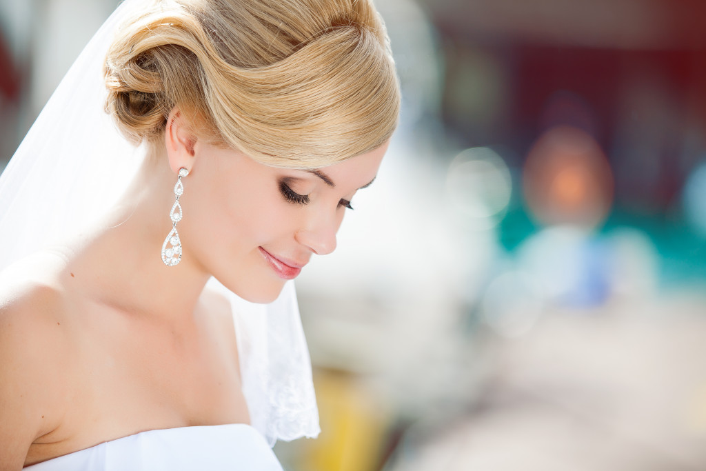 a bride looking down smiling 