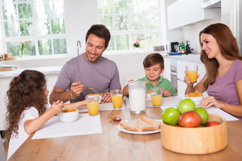 happy family eating breakfast