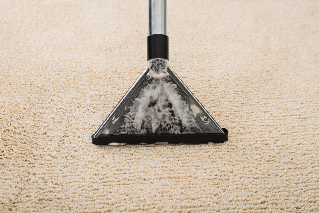An image of a carpet being vacuumed