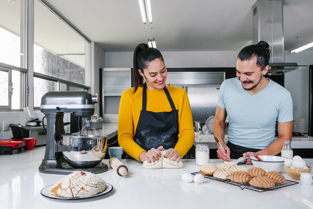 couple baking together in the home kitchen