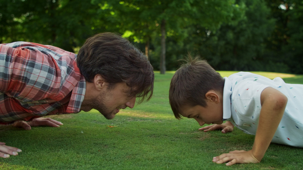 father and son doing push ups