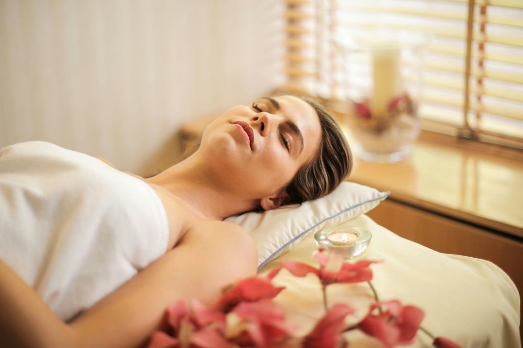 Woman relaxing on a massage bed